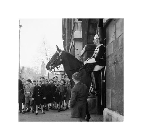 Children watch the horse guards 1960