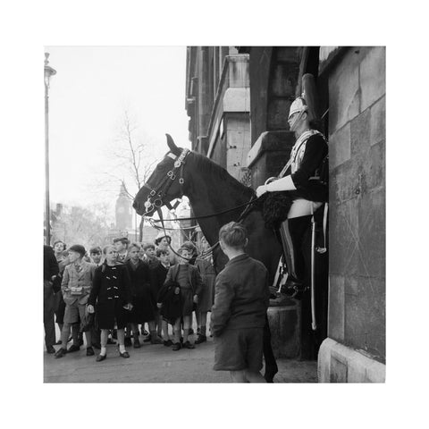 Children watch the horse guards 1960