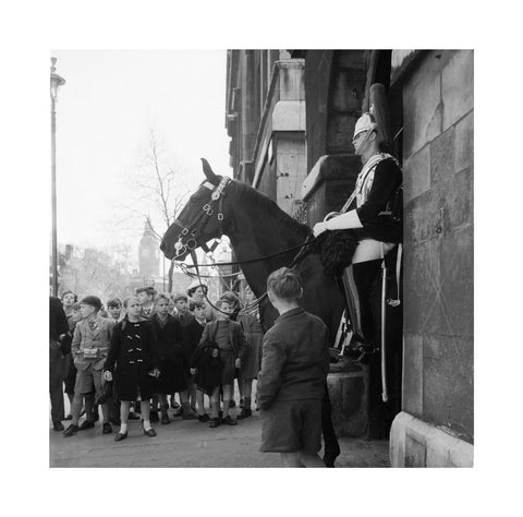 Children watch the horse guards 1960