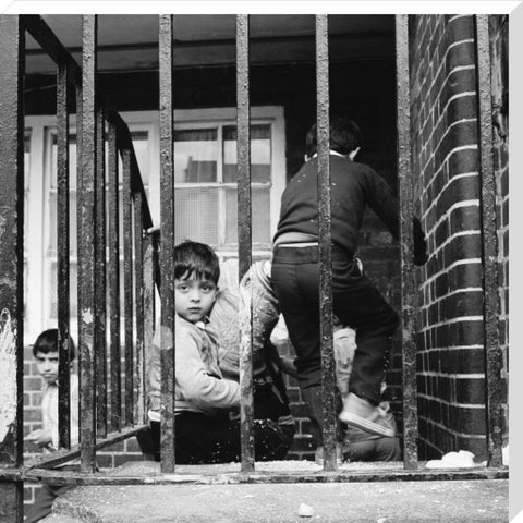 Children play outside their homes near Brick Lane 1983