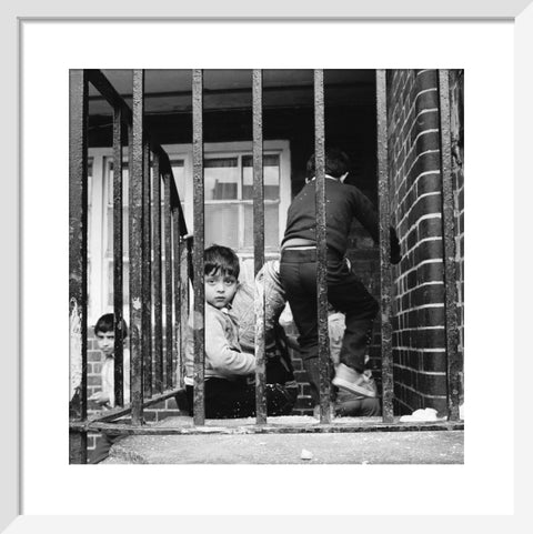 Children play outside their homes near Brick Lane 1983