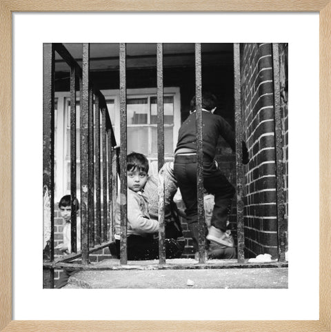 Children play outside their homes near Brick Lane 1983