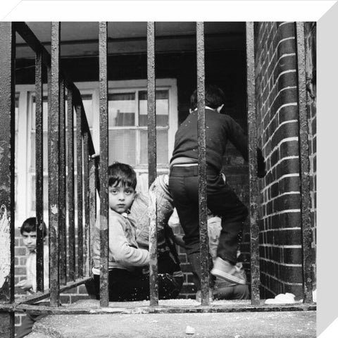 Children play outside their homes near Brick Lane 1983