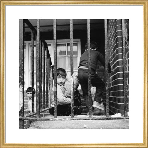 Children play outside their homes near Brick Lane 1983