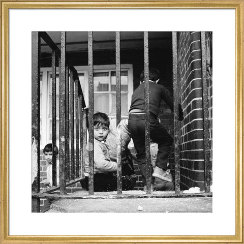 Children play outside their homes near Brick Lane 1983