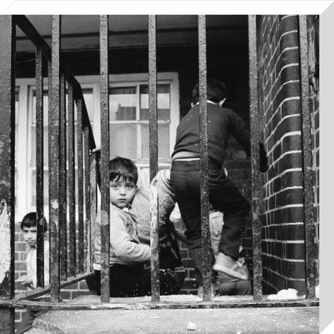 Children play outside their homes near Brick Lane 1983