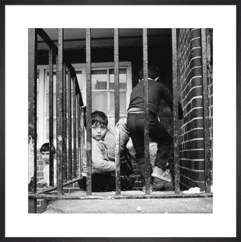 Children play outside their homes near Brick Lane 1983