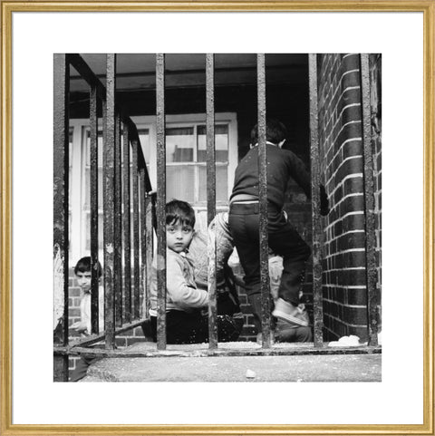 Children play outside their homes near Brick Lane 1983