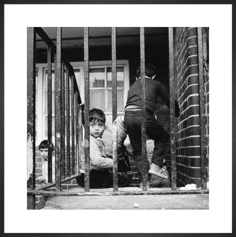 Children play outside their homes near Brick Lane 1983