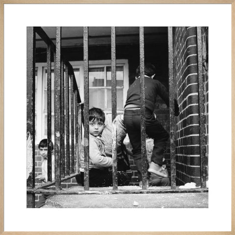 Children play outside their homes near Brick Lane 1983