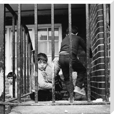 Children play outside their homes near Brick Lane 1983