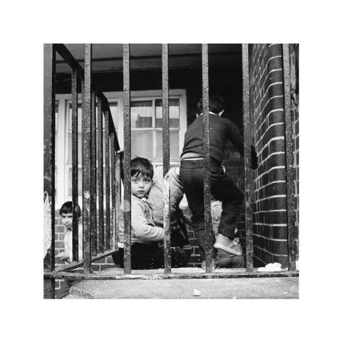 Children play outside their homes near Brick Lane 1983