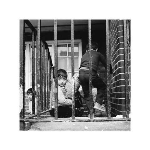 Children play outside their homes near Brick Lane 1983