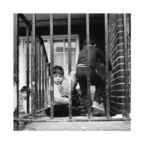 Children play outside their homes near Brick Lane 1983