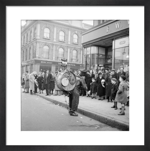 A one-man band in Camden High Street 1952