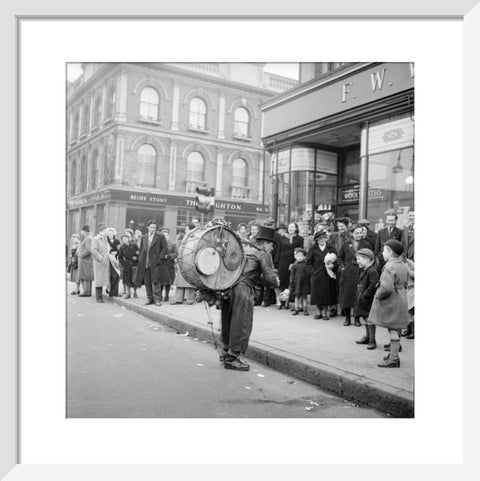 A one-man band in Camden High Street 1952