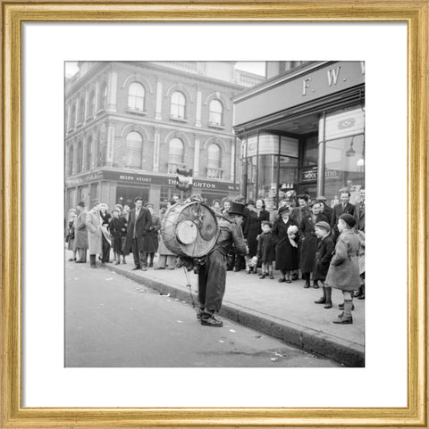 A one-man band in Camden High Street 1952