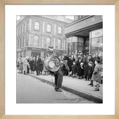 A one-man band in Camden High Street 1952