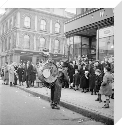 A one-man band in Camden High Street 1952