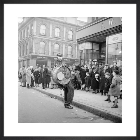 A one-man band in Camden High Street 1952