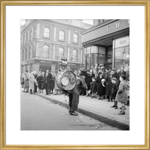 A one-man band in Camden High Street 1952