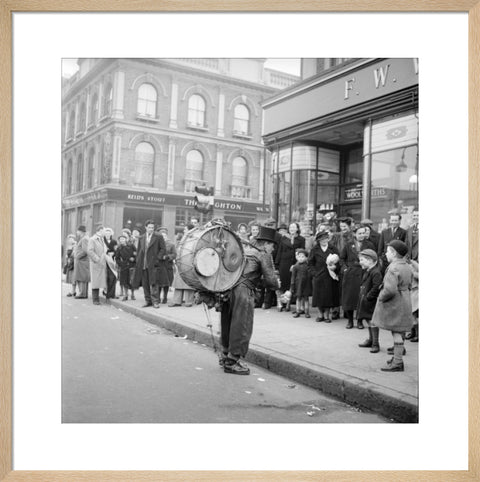 A one-man band in Camden High Street 1952