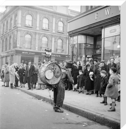 A one-man band in Camden High Street 1952