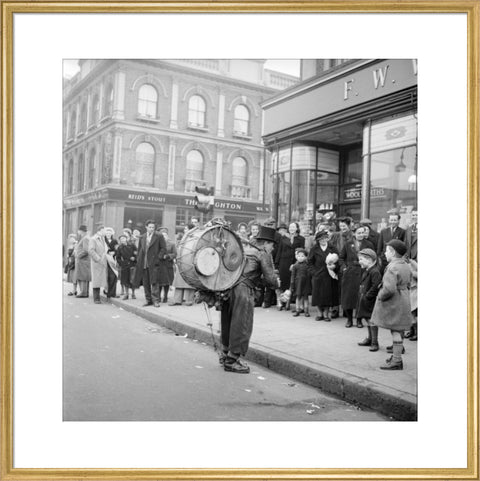 A one-man band in Camden High Street 1952