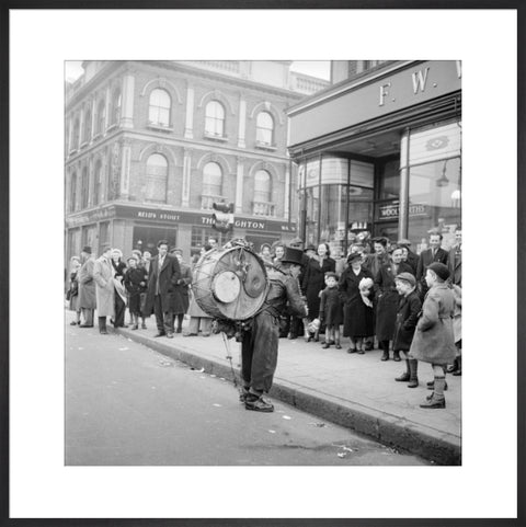 A one-man band in Camden High Street 1952