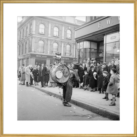 A one-man band in Camden High Street 1952