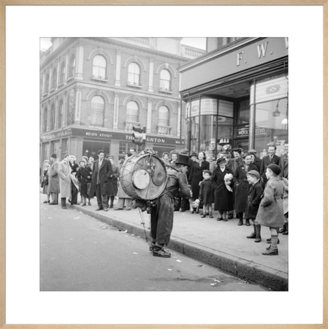 A one-man band in Camden High Street 1952