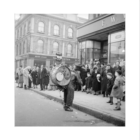 A one-man band in Camden High Street 1952