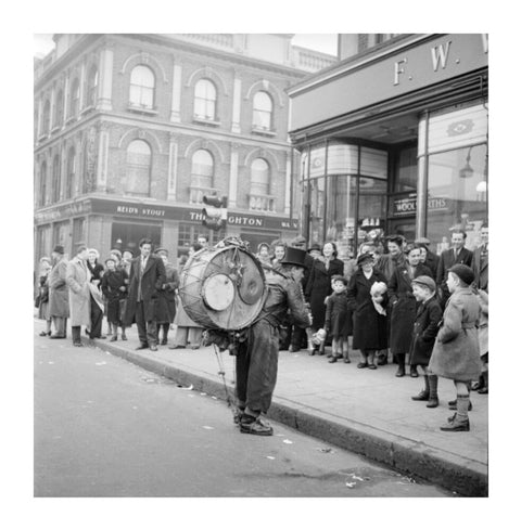 A one-man band in Camden High Street 1952