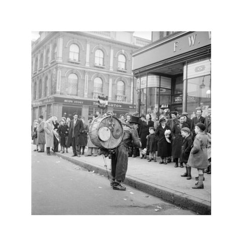 A one-man band in Camden High Street 1952