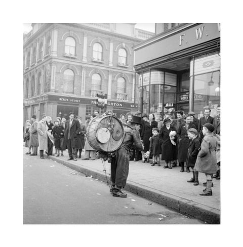 A one-man band in Camden High Street 1952