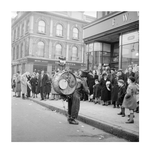 A one-man band in Camden High Street 1952