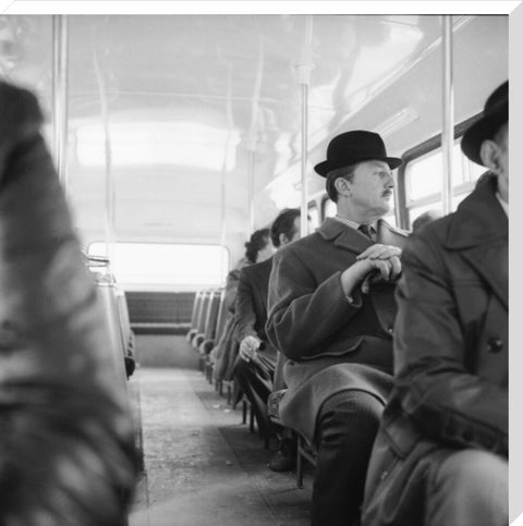 A City gent on the top deck of a London bus 20th century