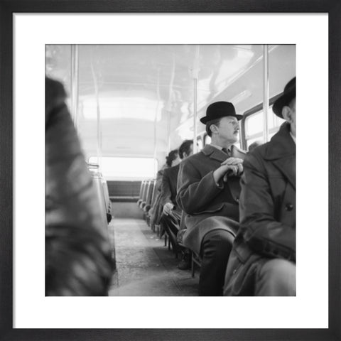 A City gent on the top deck of a London bus 20th century