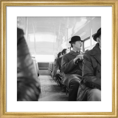 A City gent on the top deck of a London bus 20th century