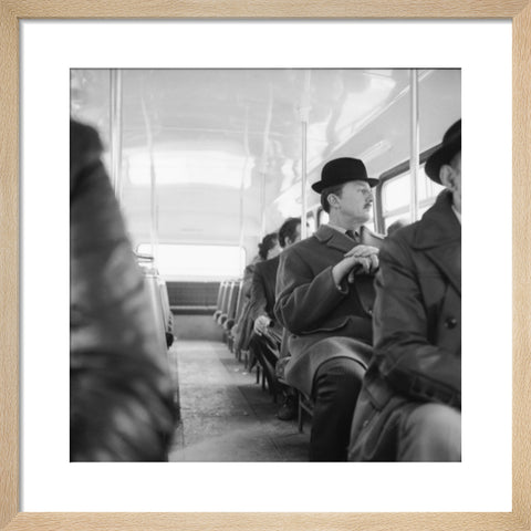 A City gent on the top deck of a London bus 20th century