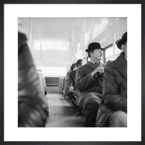 A City gent on the top deck of a London bus 20th century