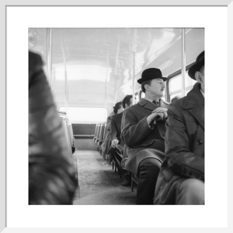 A City gent on the top deck of a London bus 20th century