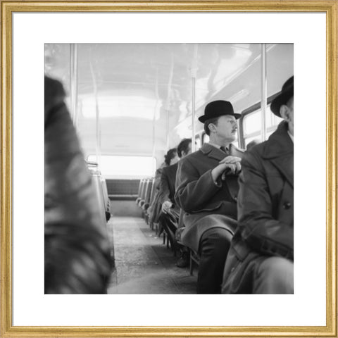 A City gent on the top deck of a London bus 20th century