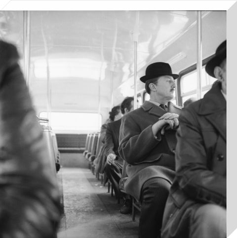 A City gent on the top deck of a London bus 20th century