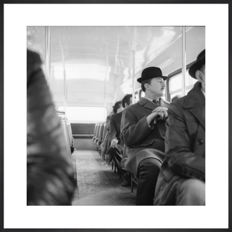 A City gent on the top deck of a London bus 20th century