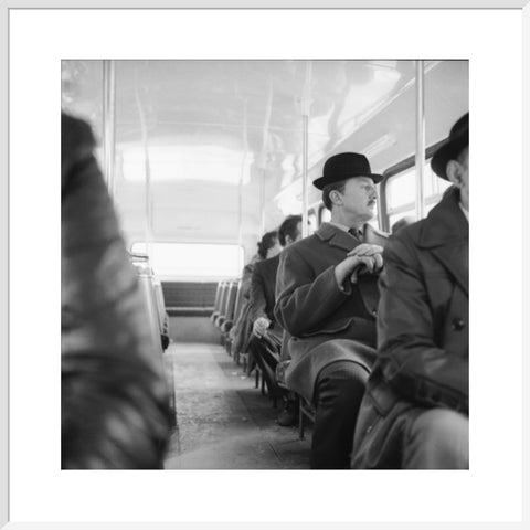 A City gent on the top deck of a London bus 20th century