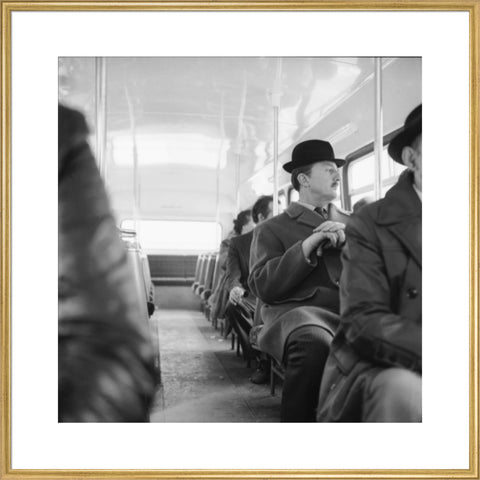 A City gent on the top deck of a London bus 20th century