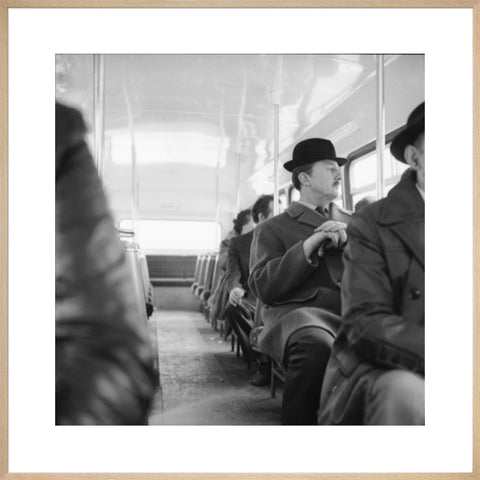 A City gent on the top deck of a London bus 20th century