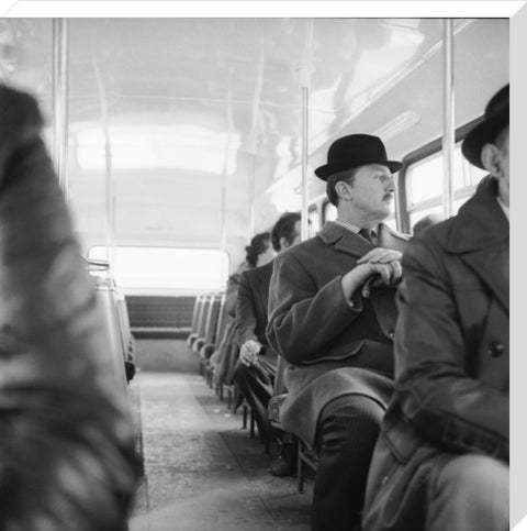 A City gent on the top deck of a London bus 20th century