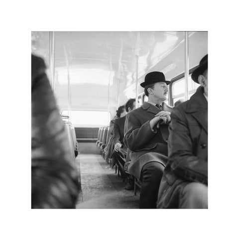 A City gent on the top deck of a London bus 20th century